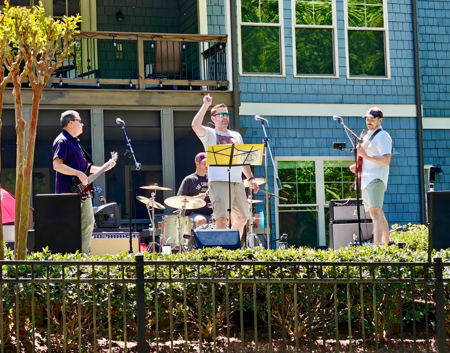Full band playing outdoor daytime gig at Masterful BBQ